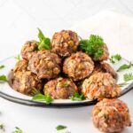 Homemade bison meatballs for dogs in a bowl.