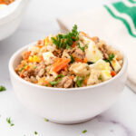 Homemade dog food with eggs in a bowl.