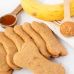 Homemade honey dog treats, honey, peanut butter, and a banana.