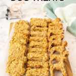 Apple oat dog treats on a wood board.