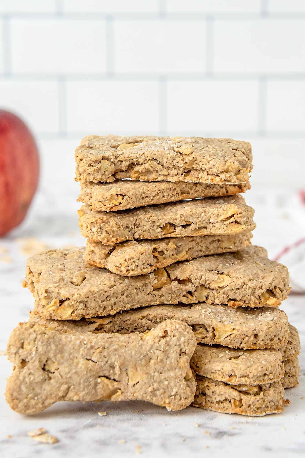 Homemade apple dog treats in a stack.