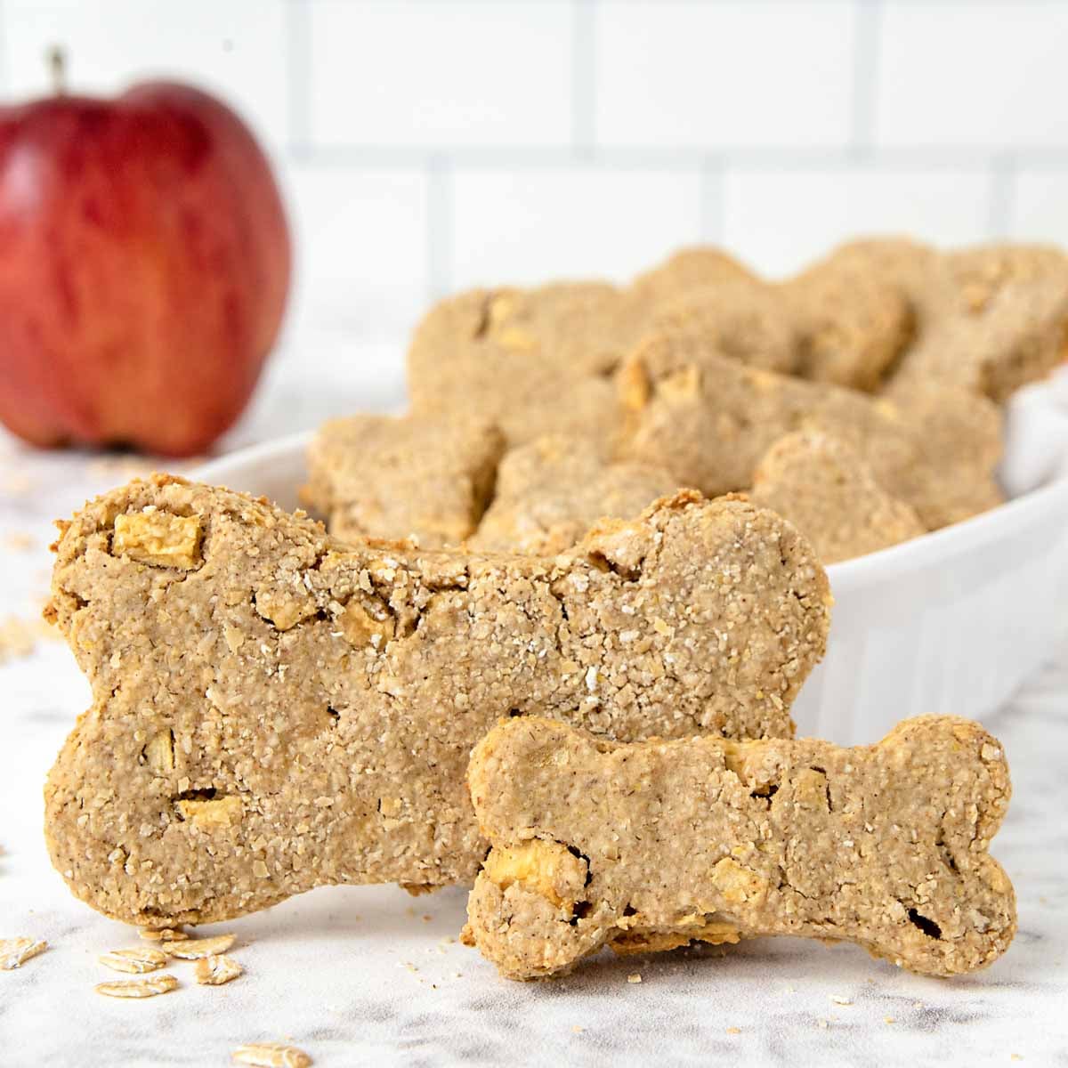 Homemade apple dog treats and an apple.