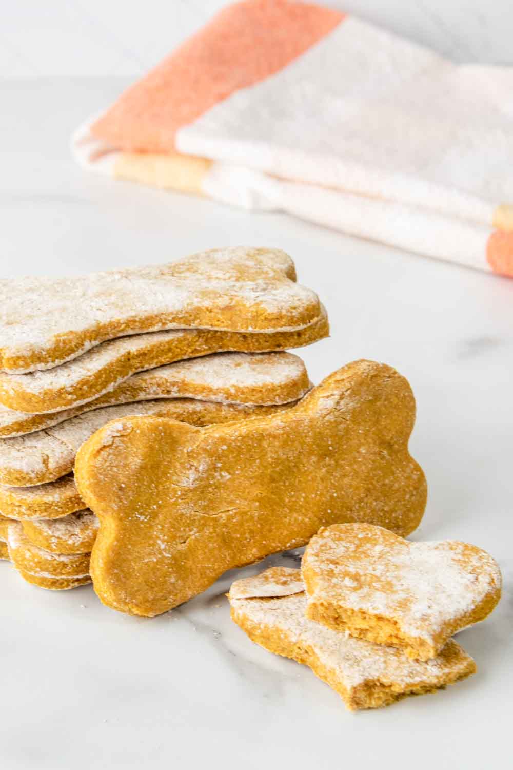 Homemade banana pumpkin dog treats in a stack.