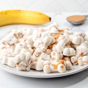 Homemade frozen peanut butter banana dog treats on a plate.