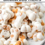 Homemade bone and paw shaped frozen peanut butter banana dog treats.