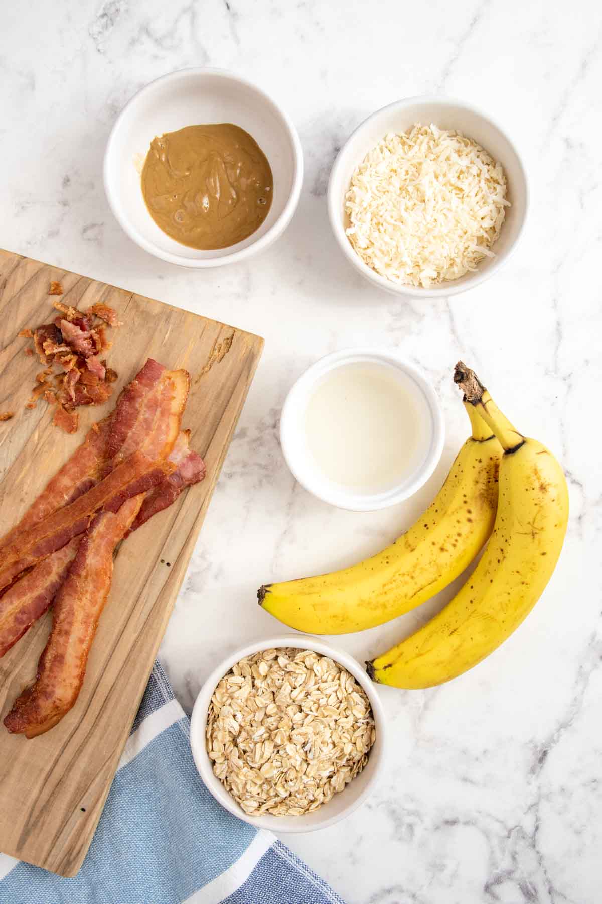 No bake banana dog treats ingredients on a marble surface.