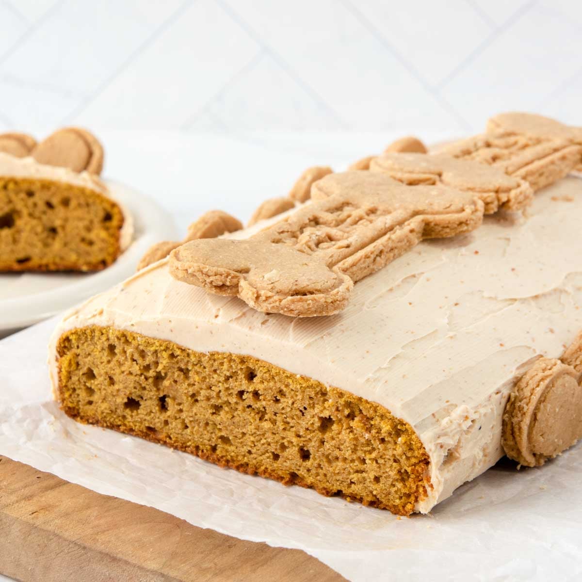Homemade pumpkin dog cake with peanut butter cream cheese frosting.