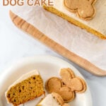 Homemade pumpkin dog cake and a slice on a plate.