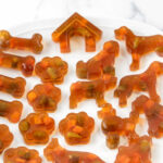 A plate of homemade gelatin dog gummy treats.