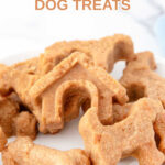 Homemade almond flour dog treats piled on a plate.