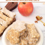 Homemade apple cinnamon dog treats, an apple, and ground cinnamon.