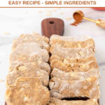 Homemade apple cinnamon dog treats on a small wood serving board.