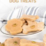 Paw and bone shaped homemade pumpkin seed dog treats.