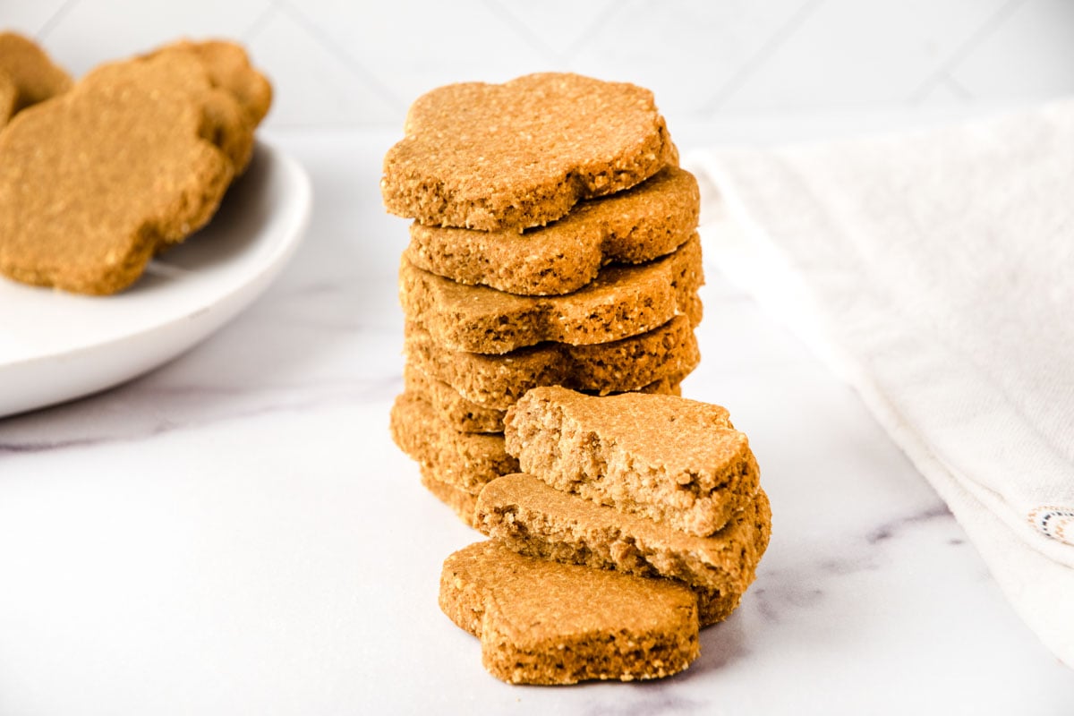 Homemade sardine dog treats in a stack and on a plate.