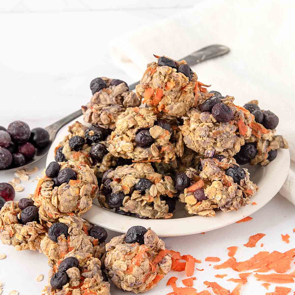 Homemade blueberry carrot dog treats on a plate.