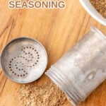 Homemade dog food seasoning in a bowl and vintage spice jar.