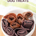 Homemade fruit leather dog treats in two flavors in a bowl.