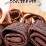 Homemade fruit leather dog treats in two flavors on a board.