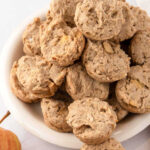 Homemade apple muffins for dogs piled on a plate.