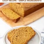 Two slices of homemade pumpkin bread for dogs on a plate and the loaf behind it.
