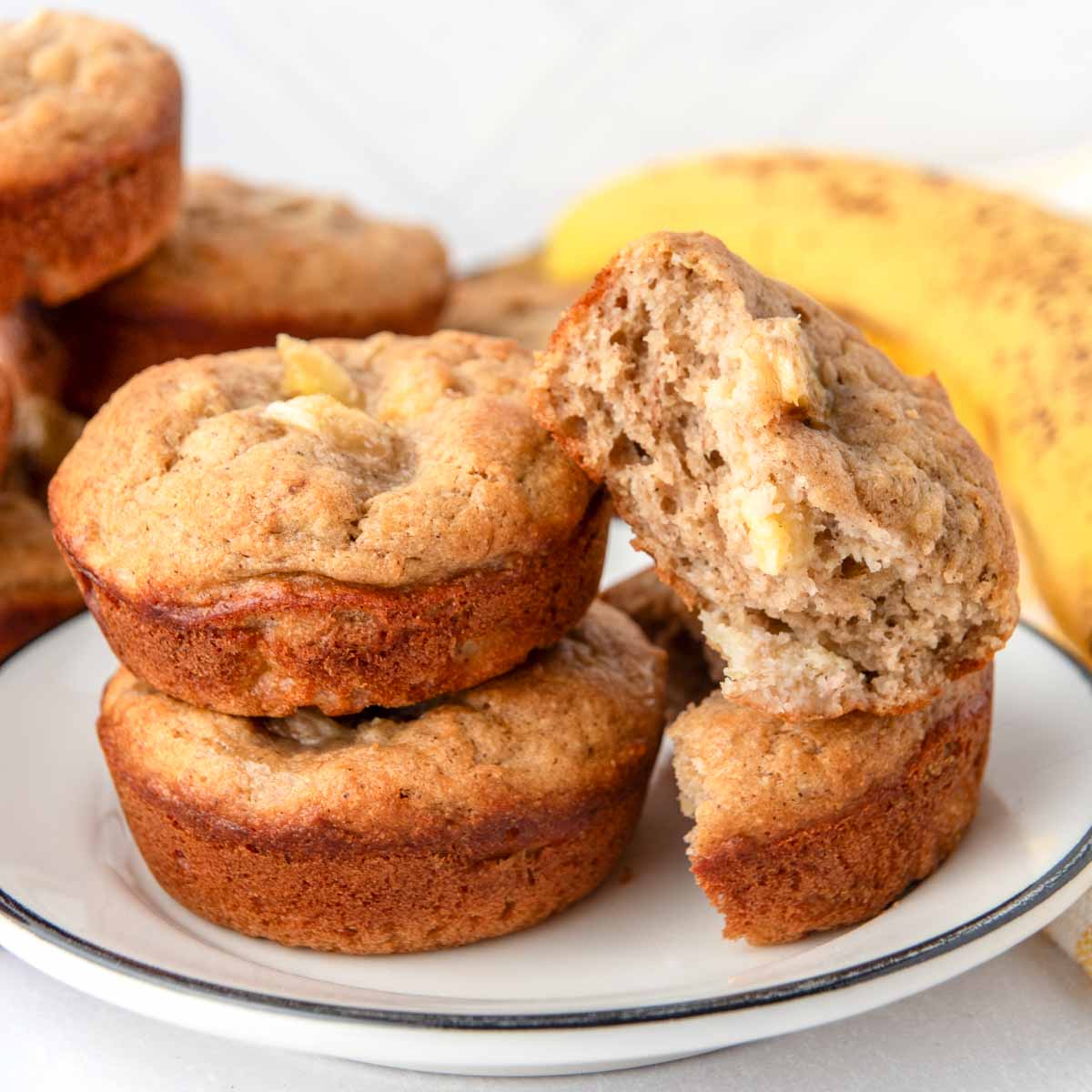 Homemade banana muffins for dogs on a small plate.
