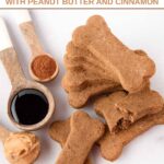 Homemade bone-shaped molasses dog treats, peanut butter, molasses, and cinnamon.