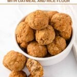 Homemade turkey pumpkin meatballs for dogs in and beside a small bowl.