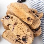 Homemade banana, peanut butter, and blueberry biscotti on a marble surface.