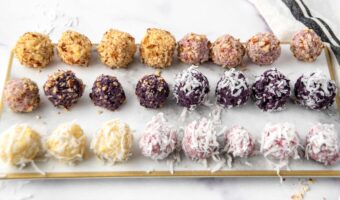 Assorted flavors of homemade fruit truffles for dogs on a platter.