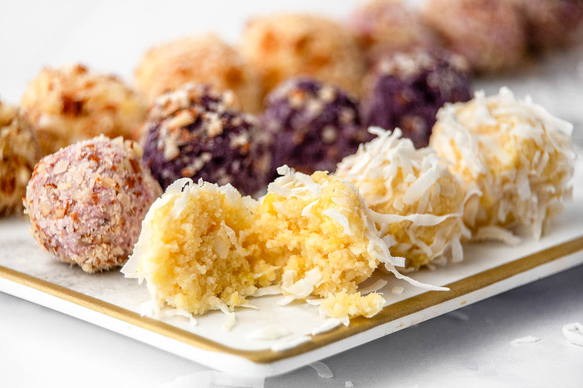 Pineapple, strawberry, and blueberry truffles for dogs on a platter.