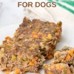 Homemade meatloaf for dogs made with ground beef, oats, and vegetables.