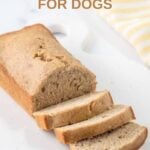 Homemade banana bread for dogs that is partially sliced.
