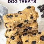 A stack of homemade bone-shaped blueberry dog treats.