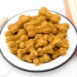 Homemade turmeric dog treats in a bowl.