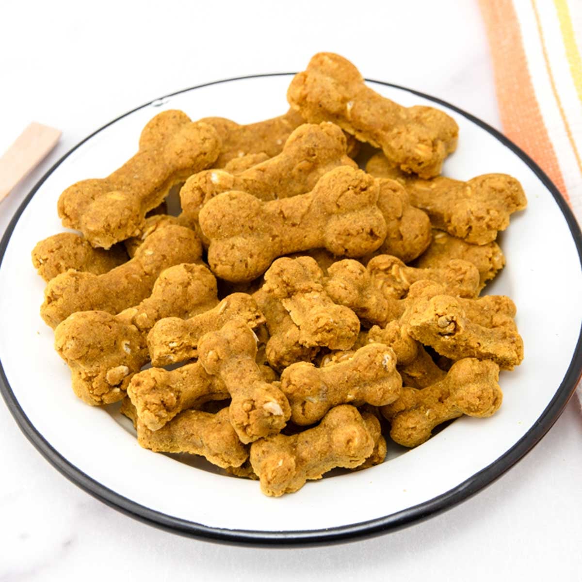 Homemade turmeric dog treats in a bowl.