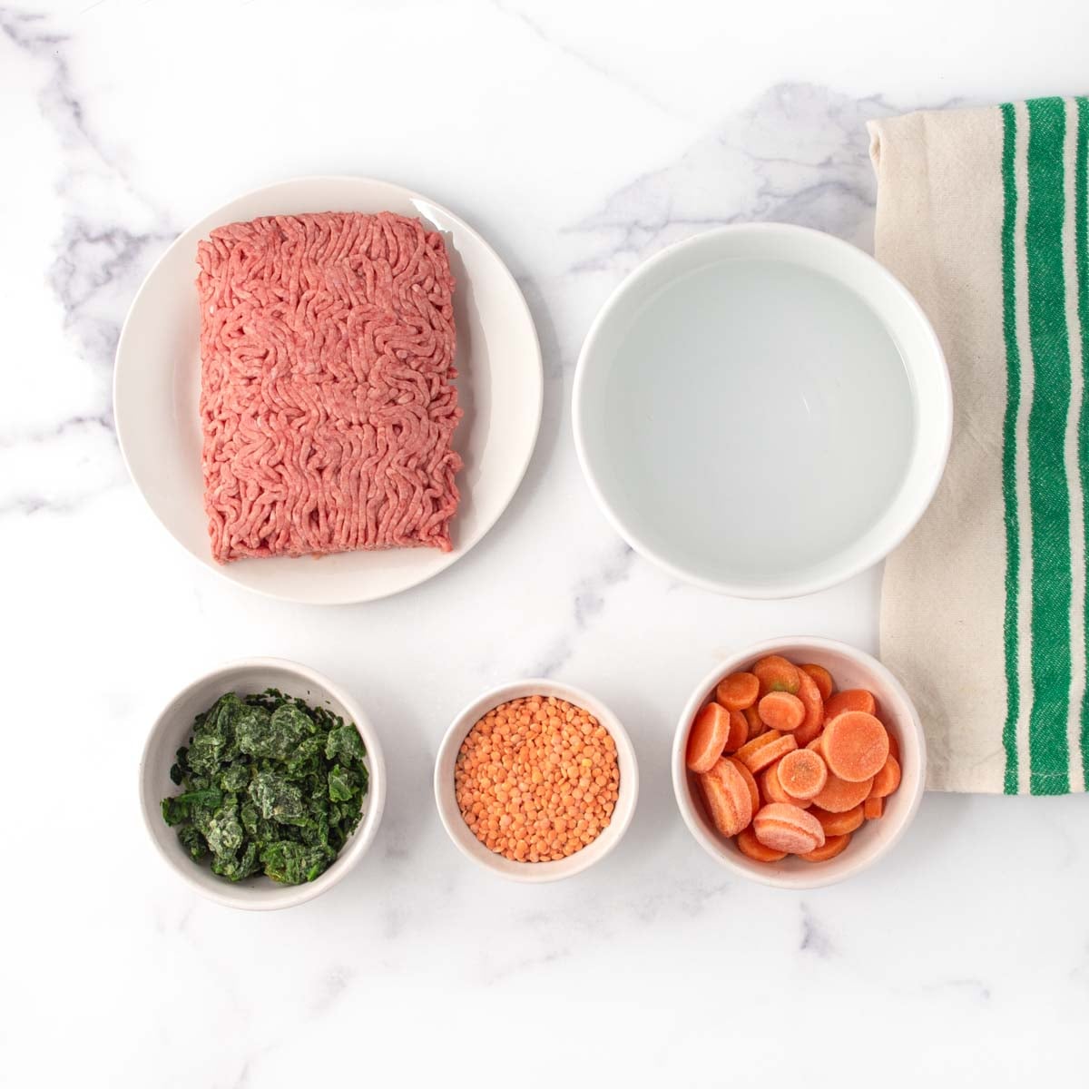Ground beef, chopped spinach, lentils, carrots, and water.