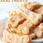 Homemade bone-shaped cheese dog treats piled on a small plate.