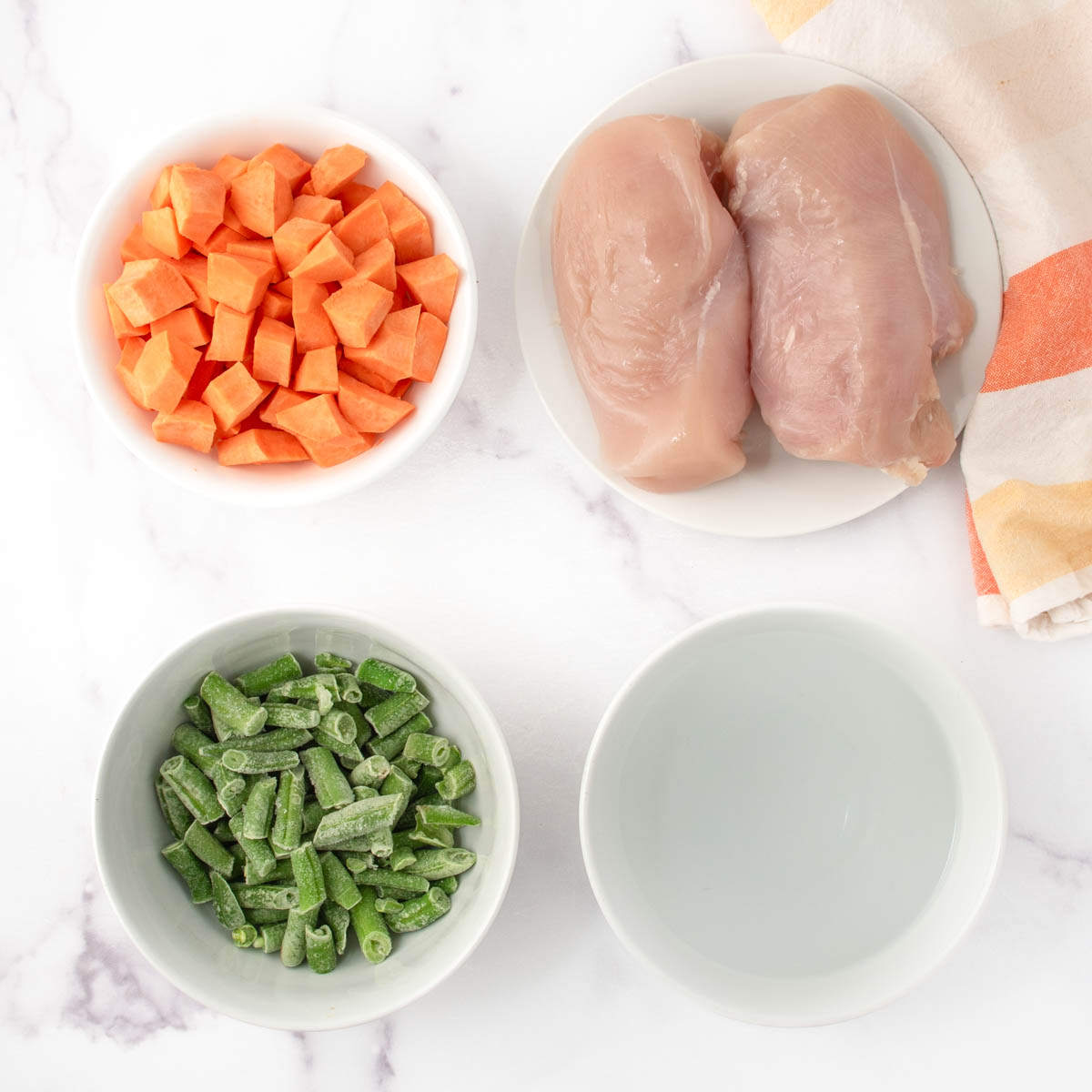 Sweet potato cubes, chicken breasts, green beans, and water.