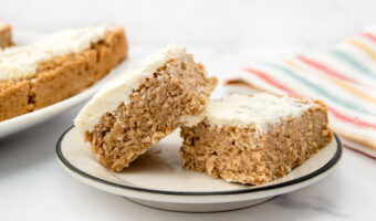 Two slices of homemade applesauce cake for dogs on a plate.