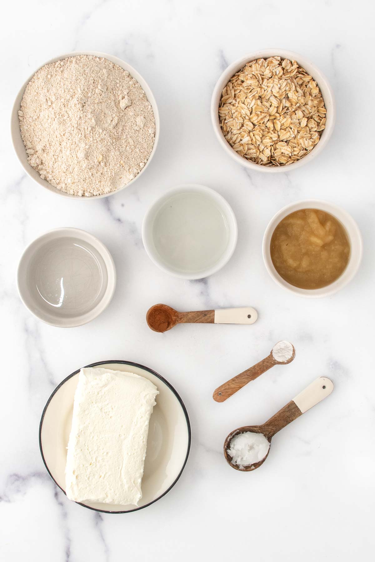 Oat flour, oats, coconut oil, water, applesauce, cinnamon, baking powder, and cream cheese.