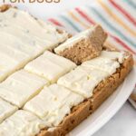 A sliced applesauce cake with cream cheese frosting made for dogs.