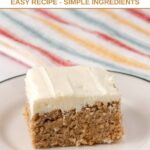A slice of homemade applesauce cake with cream cheese frosting for dogs.