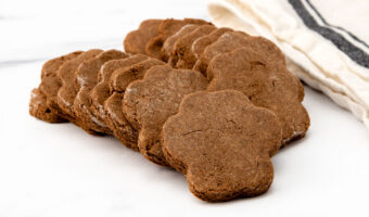 Homemade cricket protein treats for dogs in cute paw-shapes.