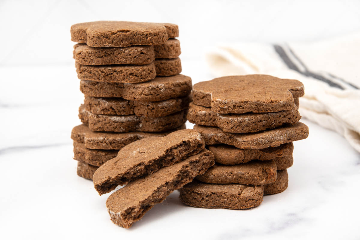 Stacks of homemade dog treats made with cricket protein powder.
