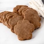 Homemade cricket protein dog treats in paw shapes.