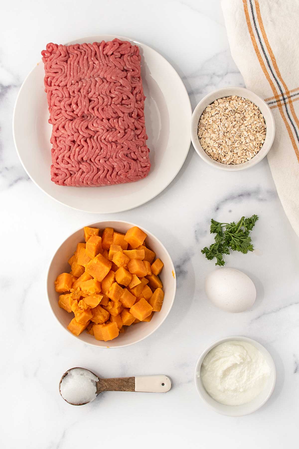 Ground beef, oats, sweet potatoes, curly parsley, egg, coconut oil, and Greek yogurt.