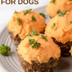 Meatloaf pupcakes with sweet potato frosting garnished with curly parsley.