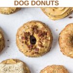 Homemade peanut butter dog donuts on a marble surface.