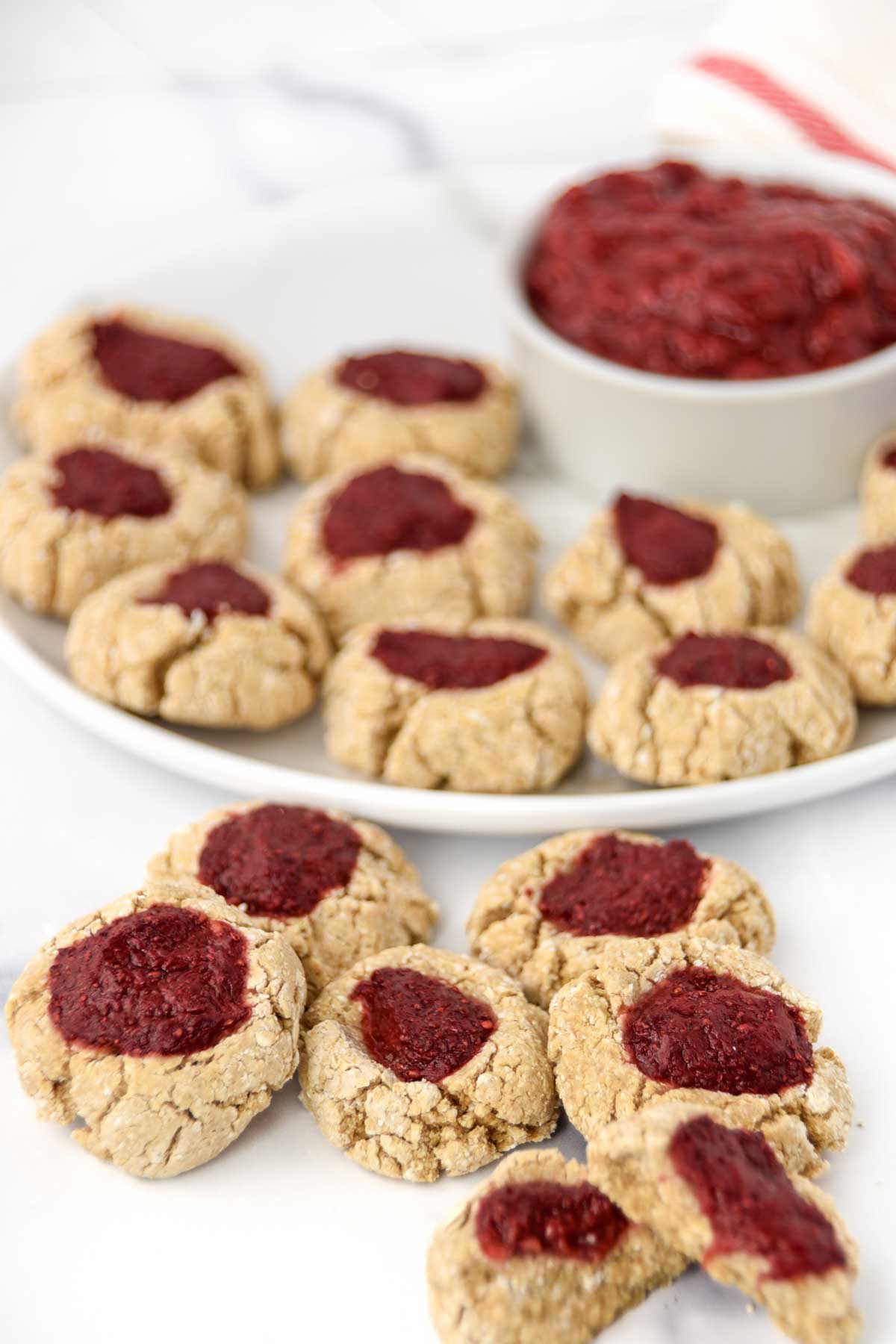 Homemade dog-friendly thumbprint cookies with strawberry jam filling.
