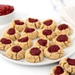 Homemade thumbprint cookies for dogs with strawberry jam filling.
